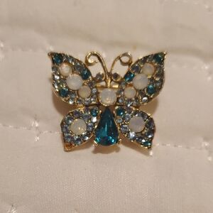 Dazzling Butterfly Brooch with Teal and Gold Hues